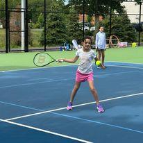 tennis with girl hitting ball