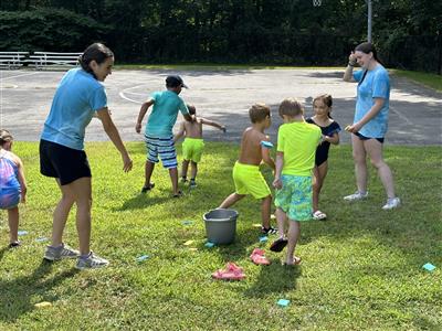 group pic of water balloon fight